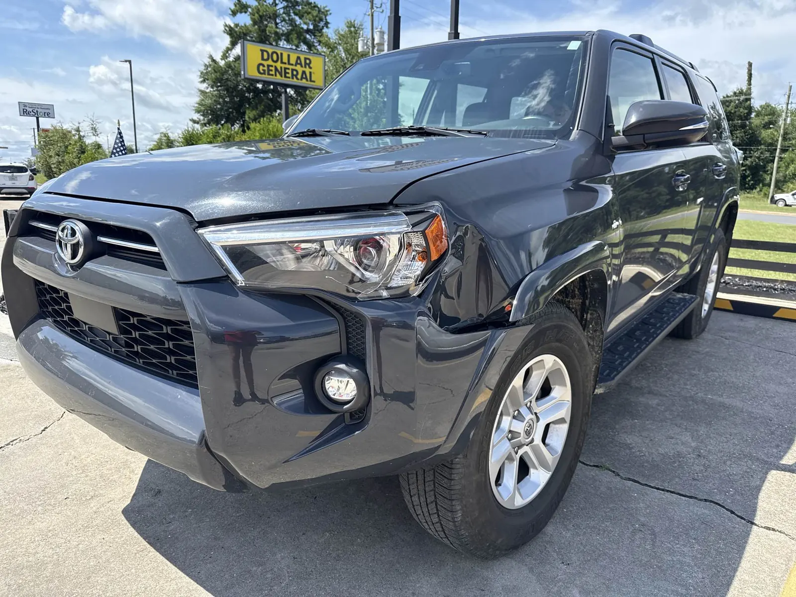 Front passenger-side fender and bumper damage on a 2024 Toyota 4Runner before repair