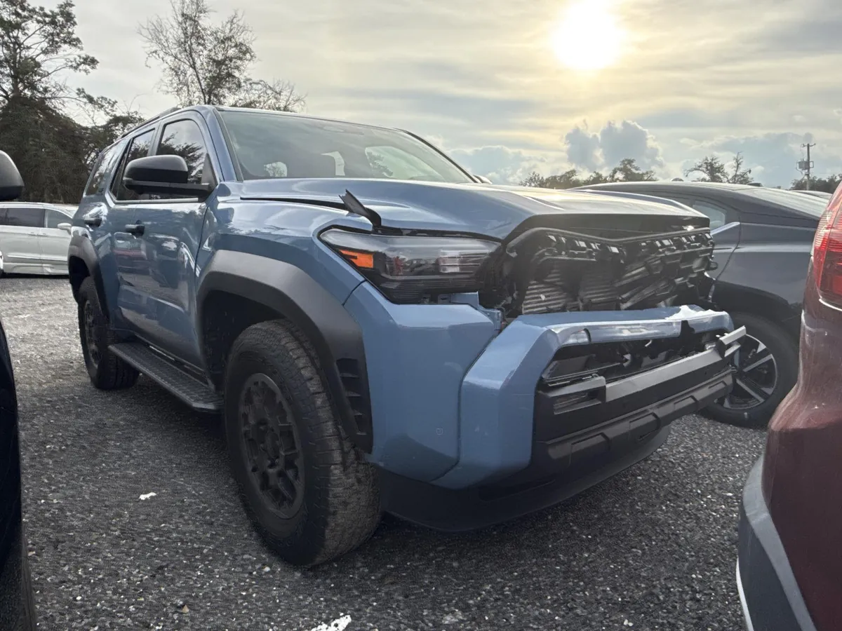 Front-end collision damage on a 2025 Toyota 4Runner before repair