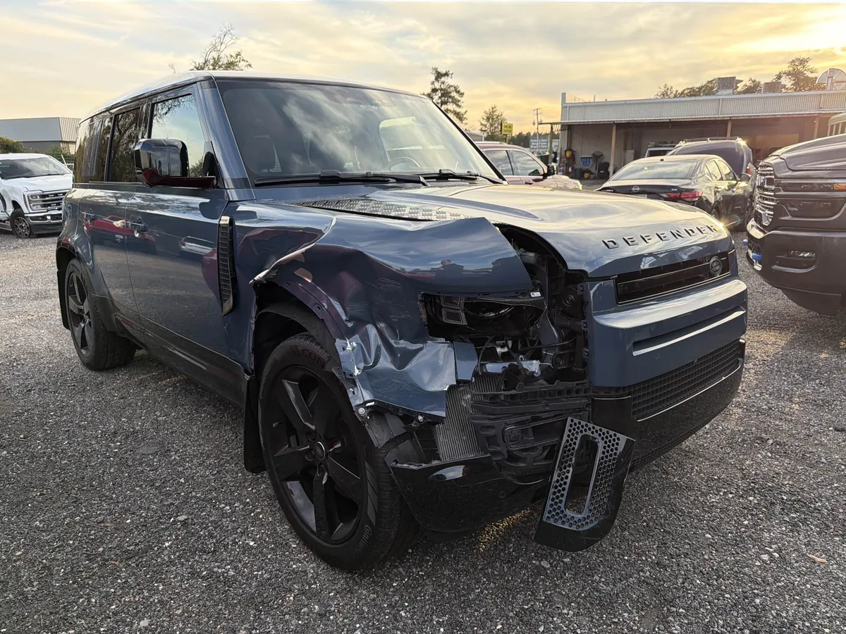 Front-end collision damage on a 2025 Land Rover Defender before repair