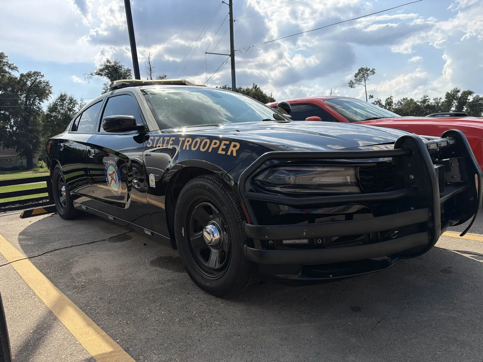 Completed front fender, door, and paint repair on a 2021 Florida Highway Patrol Dodge Charger