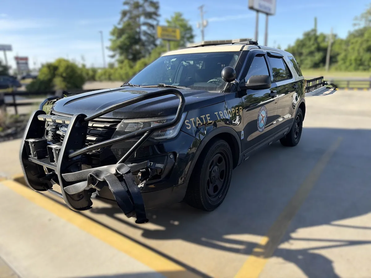 Front-end collision damage on a 2018 Ford Police Interceptor — Florida Highway Patrol unit