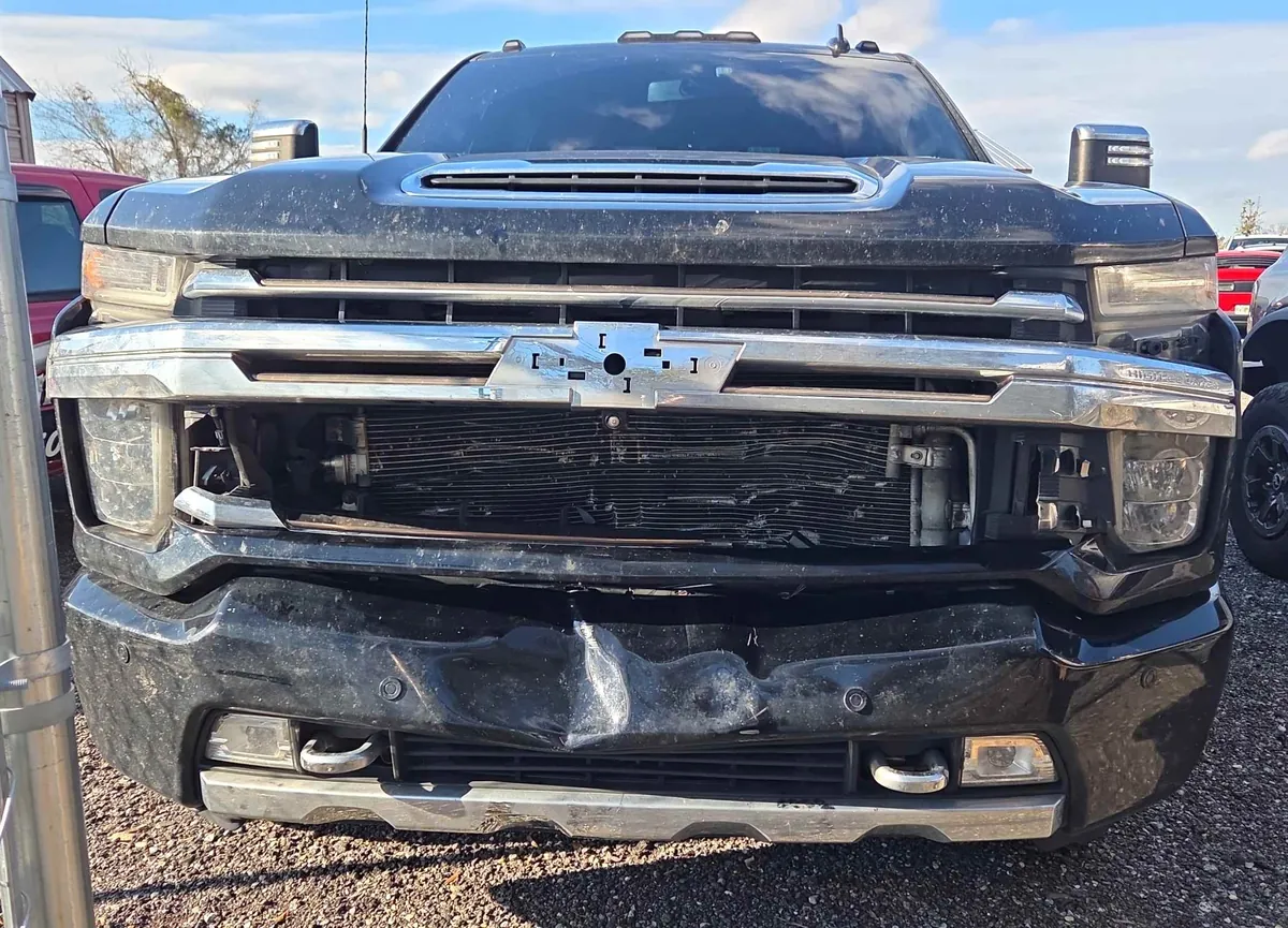Front-end collision damage on a 2022 Chevrolet Silverado 3500HD before repair