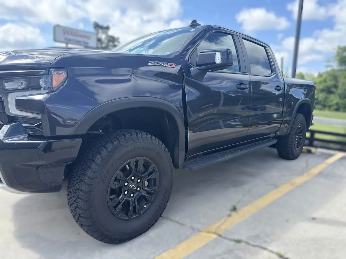 Door and side panel damage on a 2022 Chevrolet Silverado ZR2 before repair